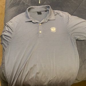 Size S but fits like a M. Pebble beach logo. Dunning. 90% polyester 10% spandex